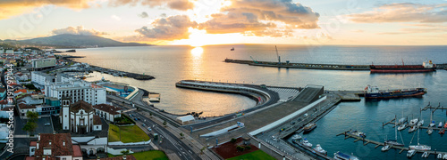 City view on the old town with harbor at Ponta Delgada, capital city of the Azores at Sao Miguel Island. Beautiful old town by the ocean. photo