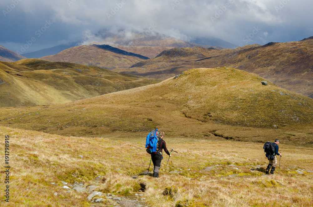 SCOTLAND, UNITED KINGDOM - MAY, 2017 : Trekkers hiking on  the Cape Wrath Trail in Scottish Highlands.