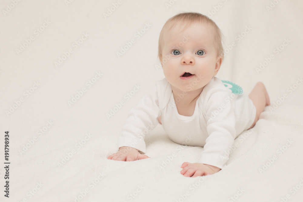 Close-up Portrait of Very Cute Adorable 8 Month Old Baby Girl Daughter with Big Blue Eyes, Happy Baby Concept, Healthy Child Close-up Portrait of Very Cute Adorable 8 Month Old Baby Girl Daughter with Big Blue Eyes, Happy Baby Concept, Healthy Child