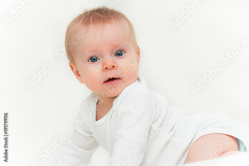 Close-up Portrait of Very Cute Adorable 6 Month Old  Baby Girl Daughter with Big Blue Eyes  Happy Baby Concept  Healthy Child