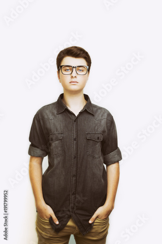 Stylish handsome young man posing in glasses. 
