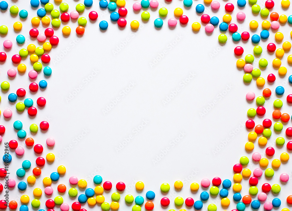 Holiday Frame of multicolored sweet candy dragees Holiday Frame of multicolored sweet candy dragees
