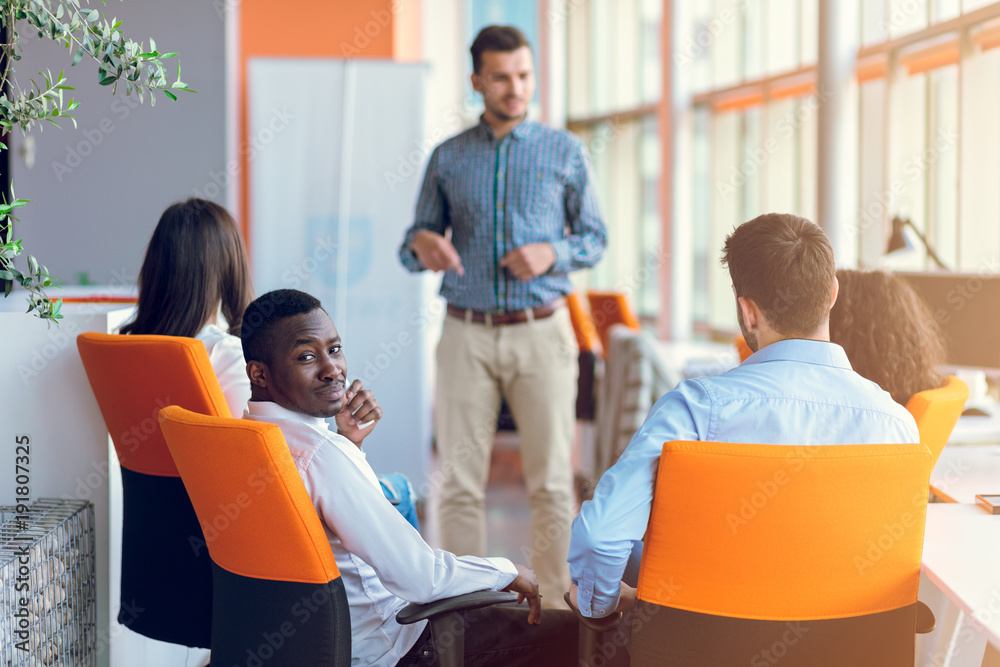Group of casually dressed businesspeople discussing ideas in the office. Group of casually dressed businesspeople discussing ideas in the office.