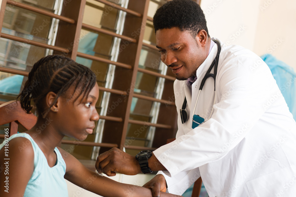 doctor is treating a patient in her office at the hospital. doctor is treating a patient in her office at the hospital.