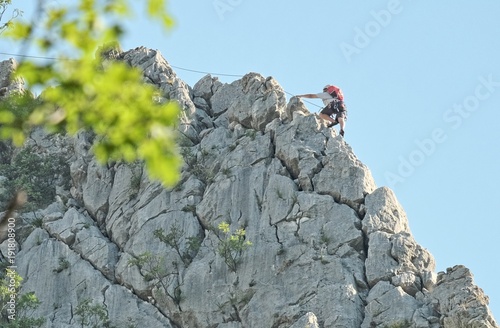 Climber On Rocky Ridge Of Vrachanski Balkan Nature Park, Bulgaria photo