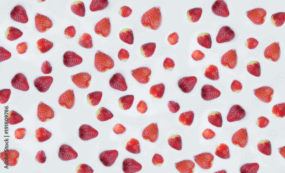 Texture of strawberry in milk. Strawberry islands in the milk ocean.

