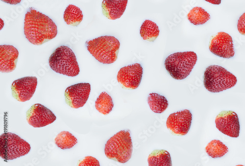 Texture of strawberry in milk. Strawberry islands in the milk ocean. 