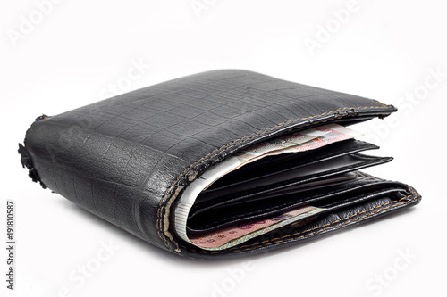Black wallet with money.