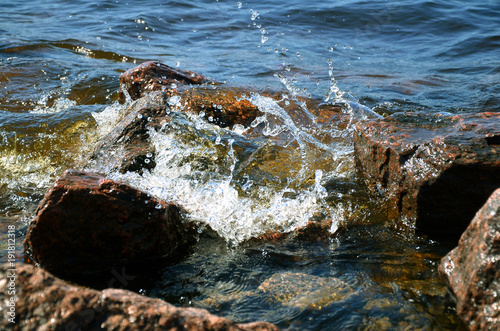 Fototapeta Naklejka Na Ścianę i Meble -  sea surf and wave splashing about coastal granite rocks