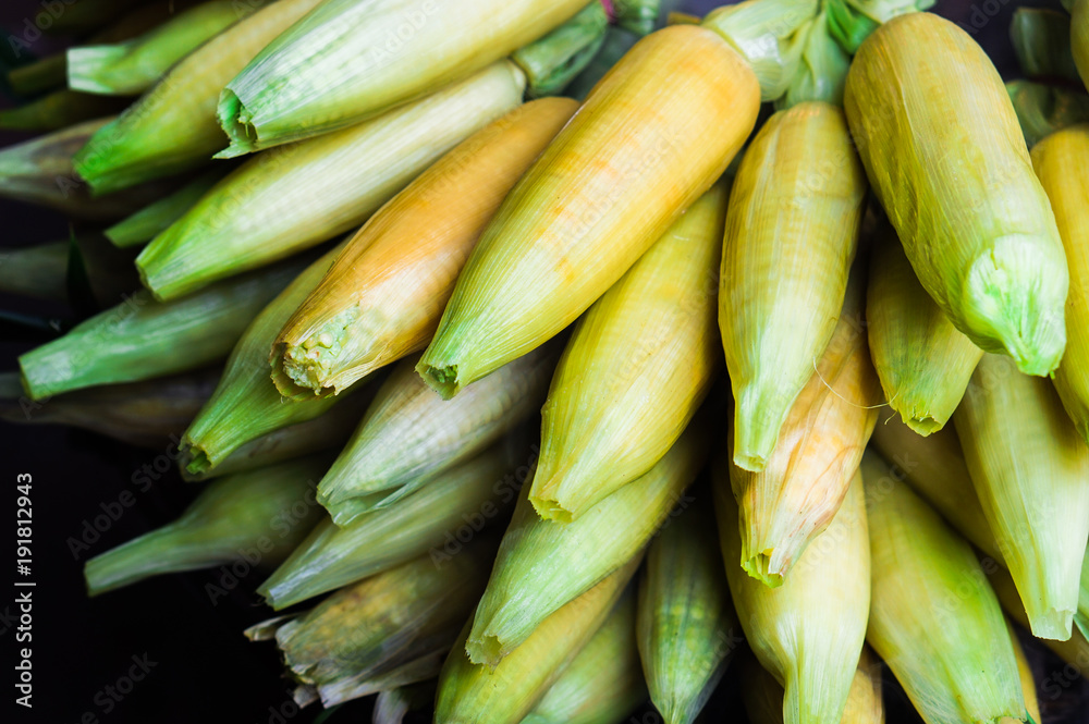 Fresh boiled and roasted corns with peels