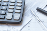 Financial objects: Stock chart, calculator and pen
