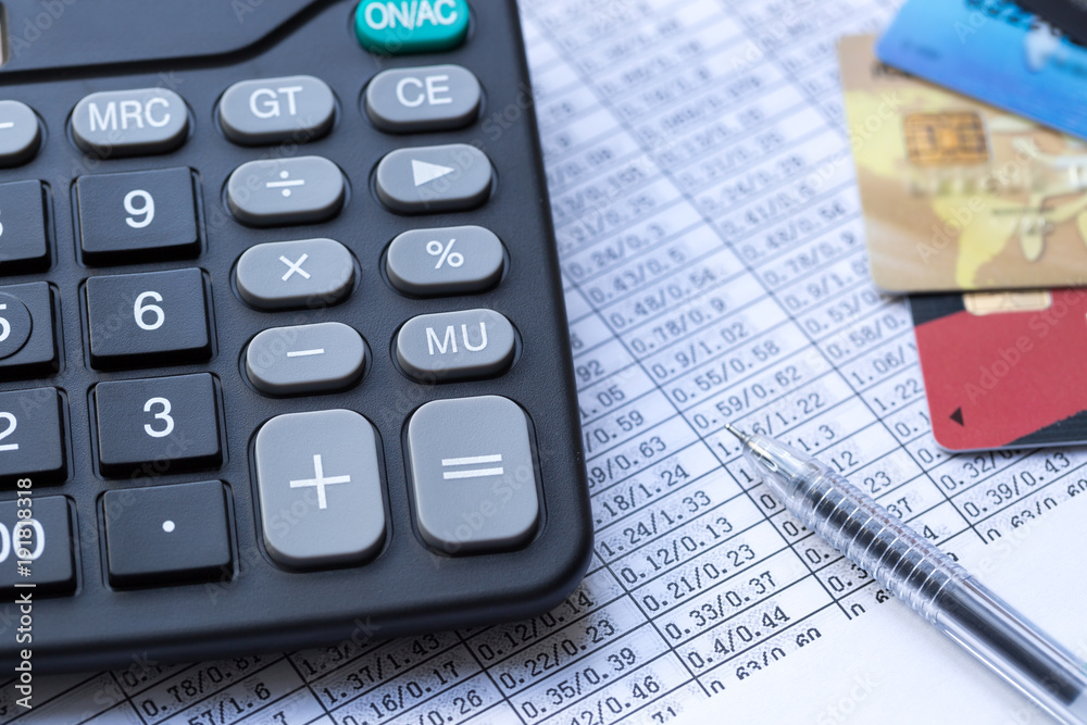 Balancing the Accounts, calculator, credit card and pen
Balancing the Accounts, calculator, credit card and pen