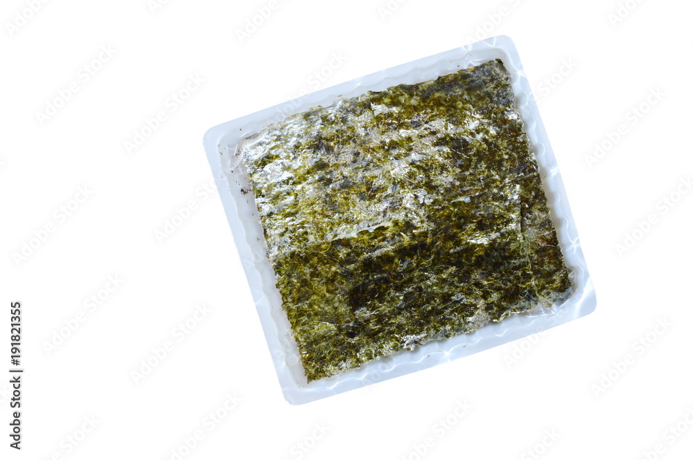 raw seaweed for cooking in plastic tray on white background raw seaweed for cooking in plastic tray on white background