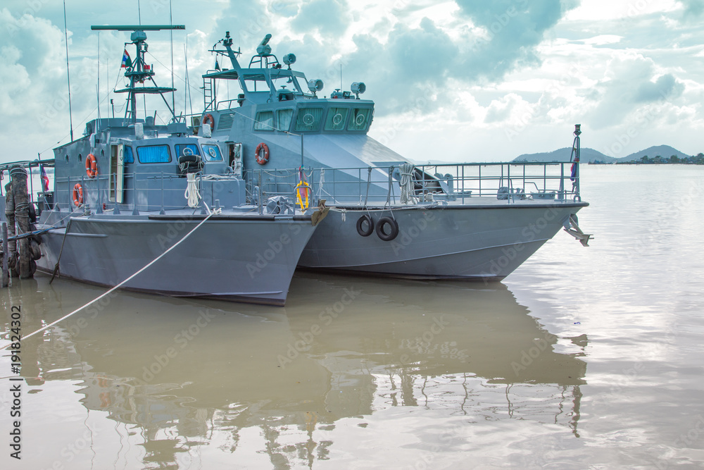 Many police boats dock on the ocean.