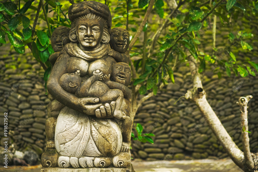 Sculpture and religion. Traditional demon statue carved in stone on Bali island, Indonesia.