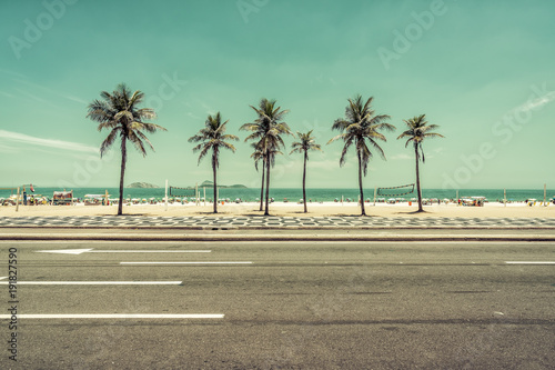 Sunny day with Palms on Ipanema Beach in Rio de Janeiro, Brazil. Wide angle view photo
