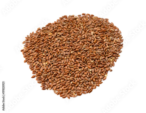 Closeup flax seeds on white background. Selective focus.