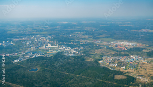 View from airplane on Earth surface. Suburb. With some hot air effect.