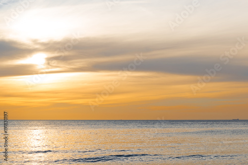 Orange sky above the water just before sunset