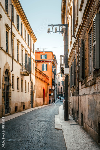 Fototapeta Naklejka Na Ścianę i Meble -  Cobbled streets on old stoned street in the beautiful evening sunset in Verona, Italy