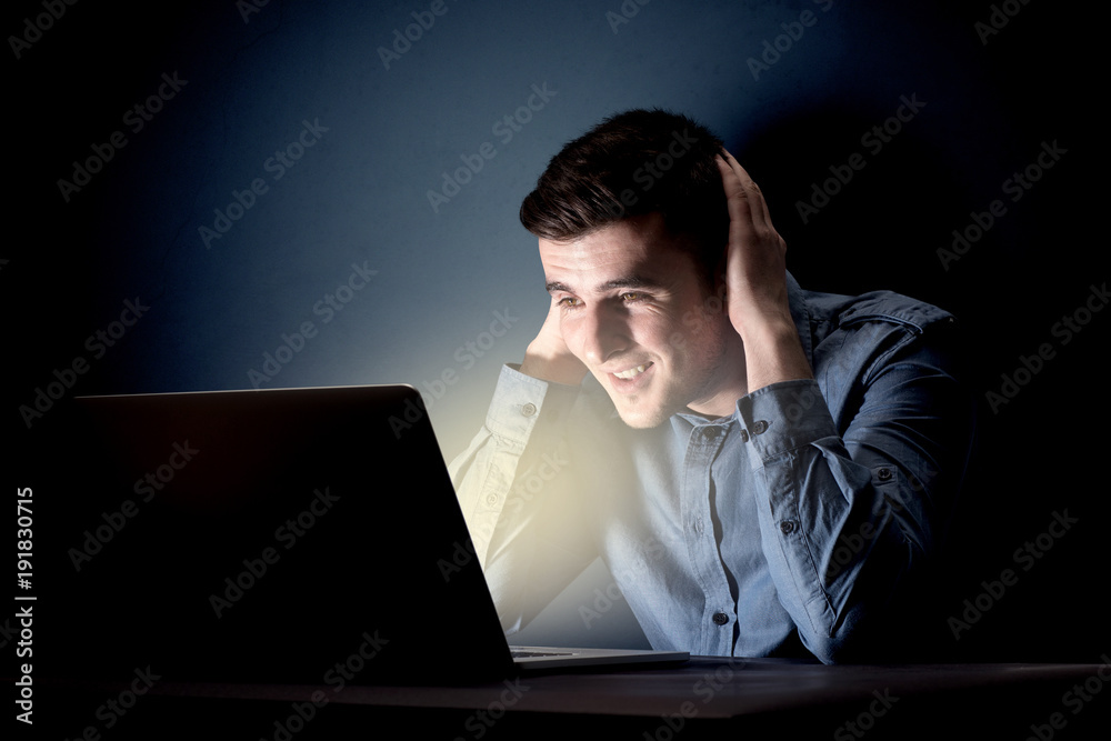 Businessman in the office at night