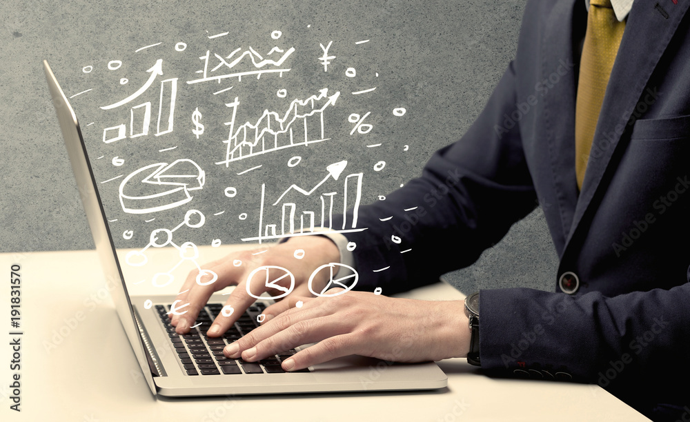 Business man drawing charts with laptop Business man drawing charts with laptop