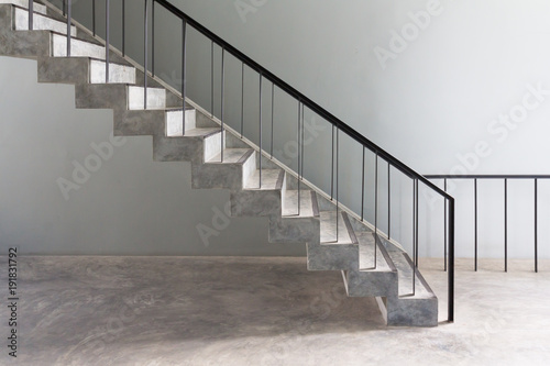 concrete stair steps and black steel ladder handle, loft style for home decoration