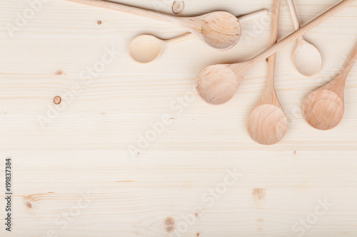 kitchen utensils. wooden spoons on table background with copy space for text. kitchenware, restaurant and cooking food concept. flat lay composition, top view