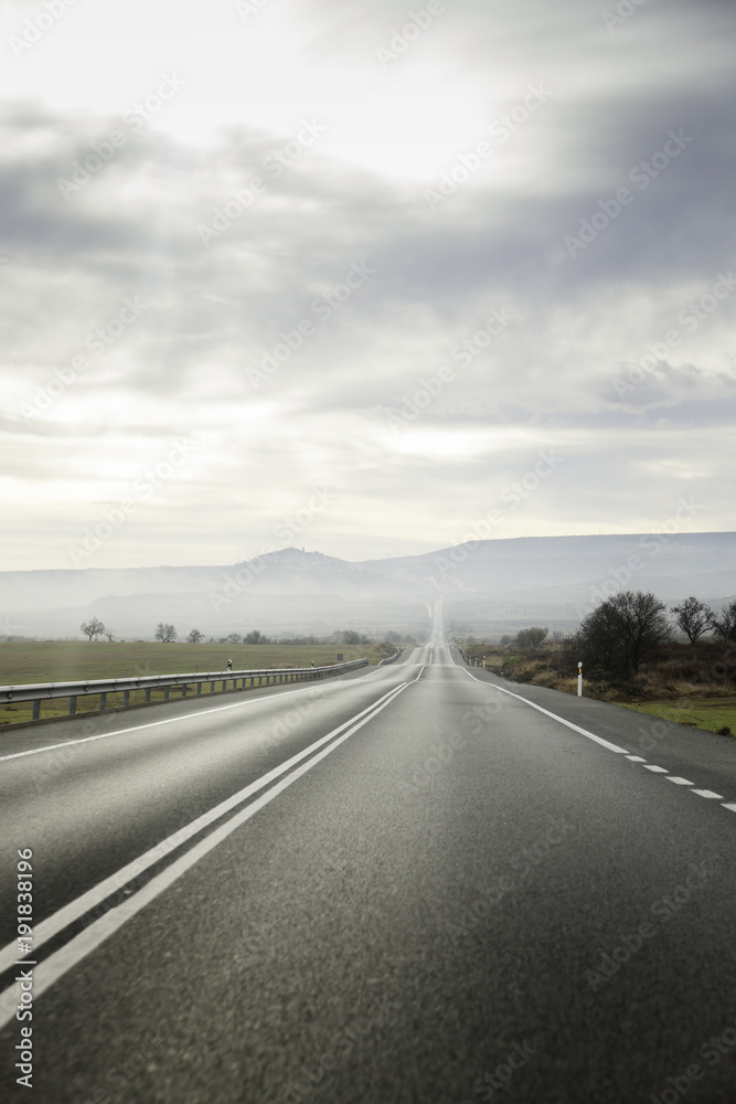 Long road on a stormy day