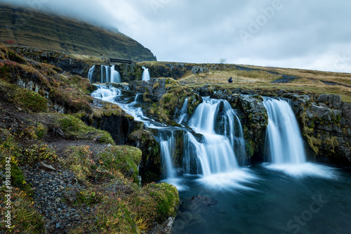 Waterfall and beautiful view at the kirkjufell mountain in iceland europe