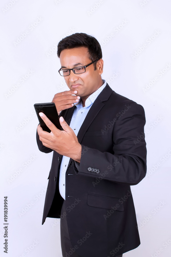 Young man operating smartphone Young man operating smartphone