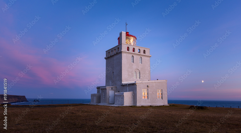 White lighthouse at south iceland coast dyrholaey