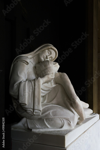 More than 100 years old religious statue Madonna and Christ (compassion)