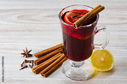 Mulled wine glintwine served in glasses for christmas table photo