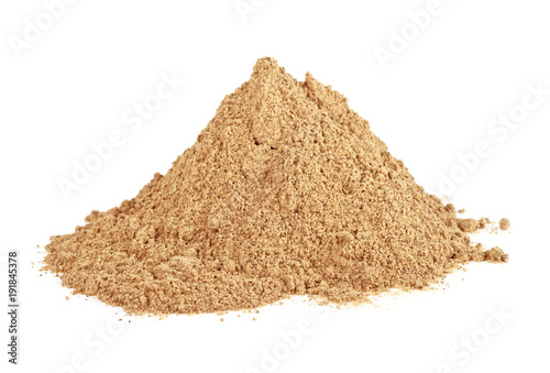 Pile of cinnamon powder isolated over white background