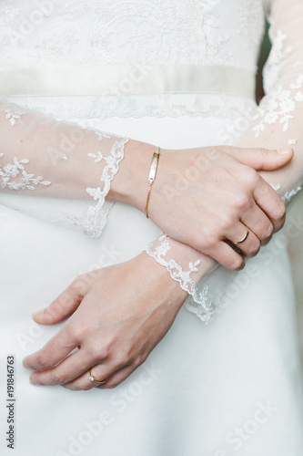 woman`s, bride`s fine hands lace white wedding dress