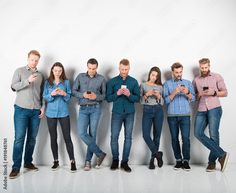 Group of boys and girls connected with their smartphones. Concept of internet and social network