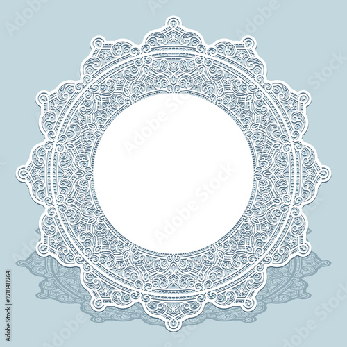Round lace doily with cutout paper border ornament