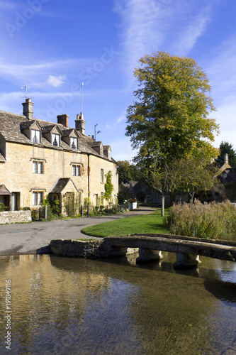 The idyllic Cotswold stone riverside cottages of Lower Slaughter in autumn sunshine, Gloucestershire, UK © Chris Rose