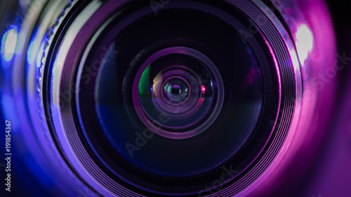 Camera lens and multi-colored backlight blue and purple.