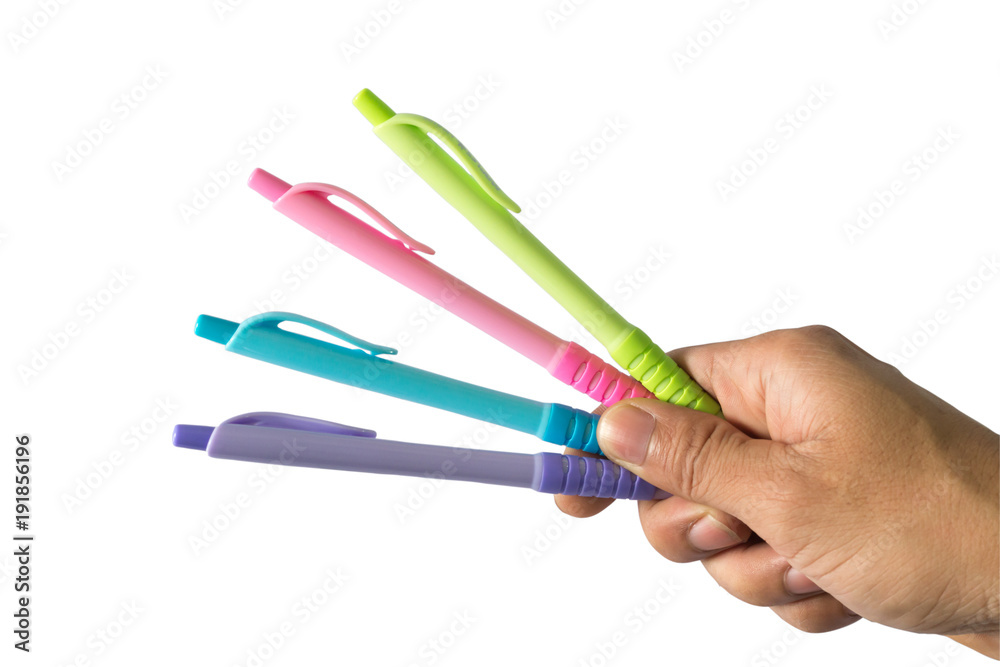 Color pens in hand that hold together many colors. Has a white background. Clipping path