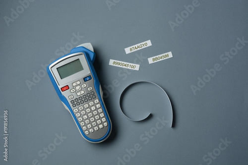 labeler with labels beside on gray table