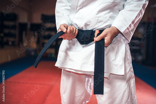 Male person in white kimono with black belt