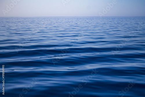 Wallpaper Mural Clean minimalistic blue ocean water with waves Torontodigital.ca