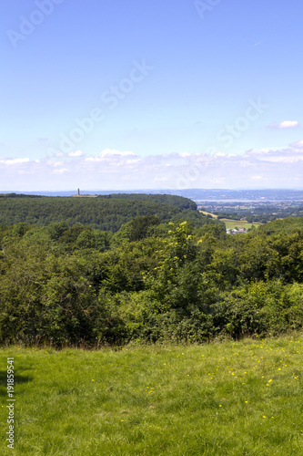 View towards the Tynedale Monument on the edge of the Cotswold Hills escarpment near Wotton Under Edge, Gloucesteshire, UK. photo