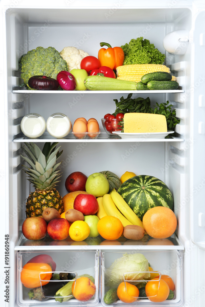Open fridge full of vegetables and fruits Open fridge full of vegetables and fruits