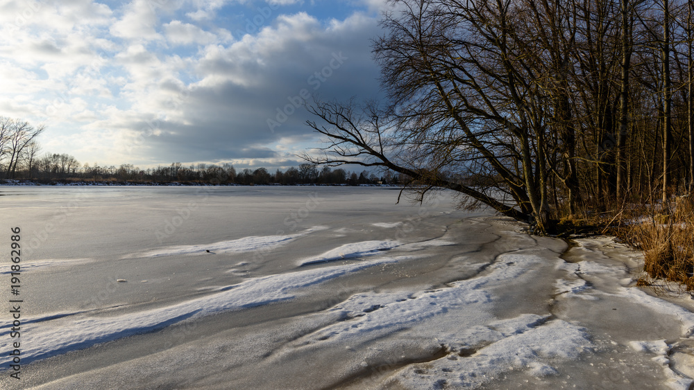 colorful winter sunset on frozen river ice colorful winter sunset on frozen river ice