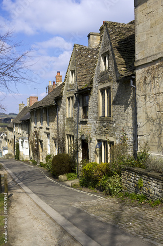 Quaint Cotswold cottages in early spring sunshine on The Hill, Burford, Oxfordshire, UK
