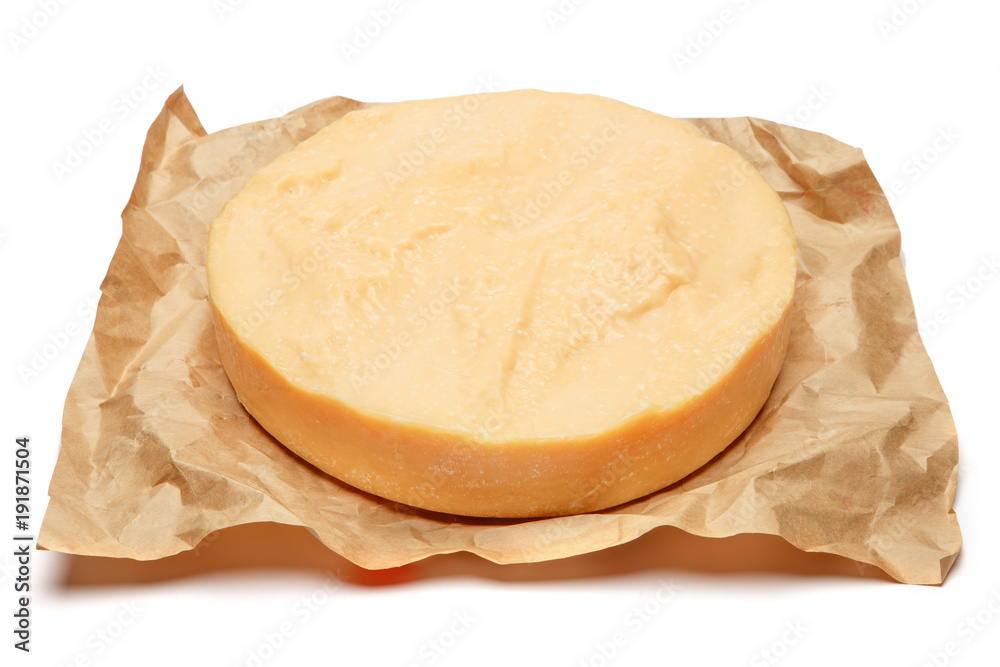 Whole round Head of parmesan or parmigiano hard cheese on white background Whole round Head of parmesan or parmigiano hard cheese on white background