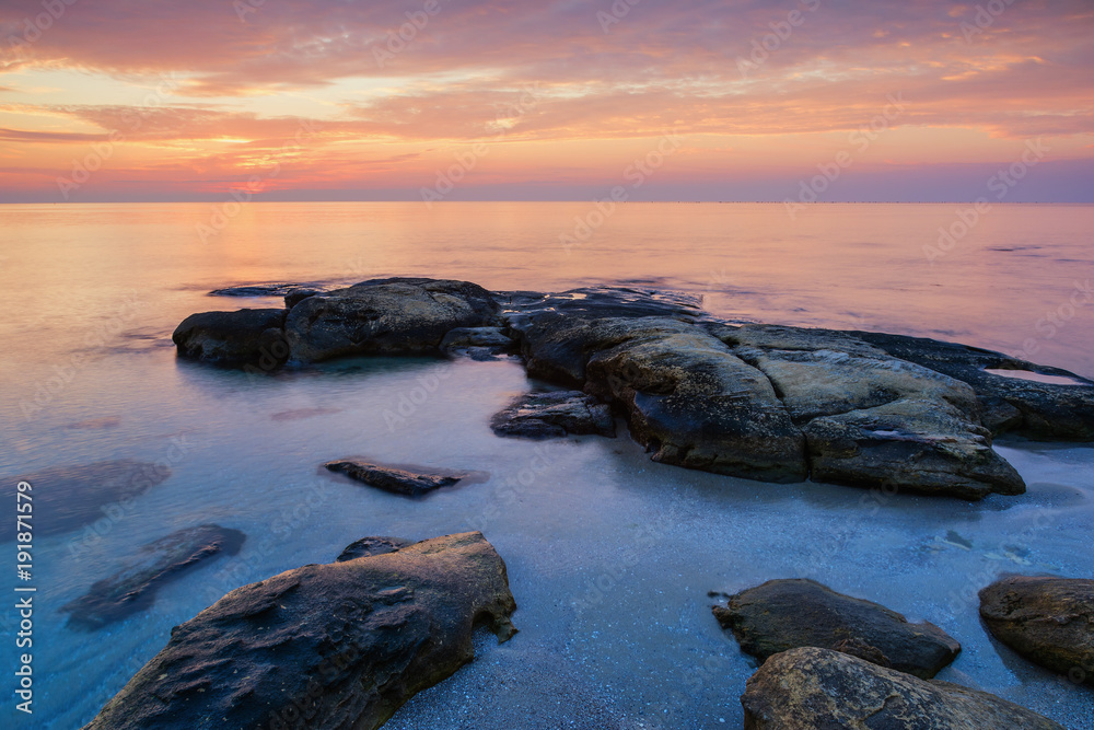 Sea sunrise at the Black Sea coast near Ravda, Bulgaria. Rocky sunrise.